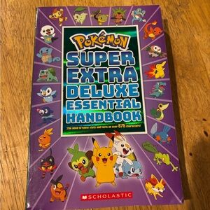 Scholastic Pokémon Handbook with Purple Cover